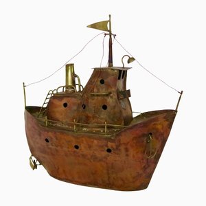 Escultura de barco en latón y cobre