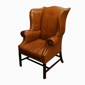 19th Century Tan Leather Wingback Armchair with Out-Scrolled Arms & Brass Stud Detailing, 1800s