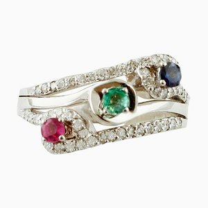 Anello a tre pietre in oro 18 carati con smeraldo, zaffiro blu, rubino e diamanti