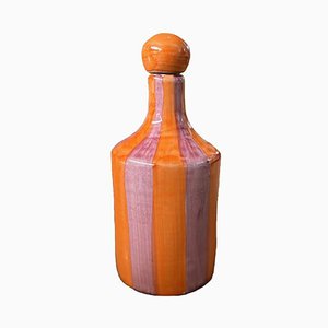 Bottiglia rossa arancione con strisce di Popolo