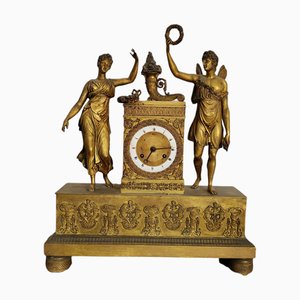 Reloj de repisa francés de bronce patinado y ormolú, siglo XIX