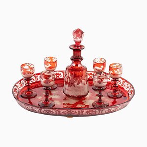 Vasos y jarra bohemios de cristal rojo, siglo XIX. Juego de 8