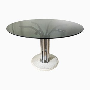 Mesa de comedor italiana redonda con tablero de vidrio ahumado y base de mármol