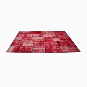 Alfombra moderna de patchwork de lana en rojo y borgoña