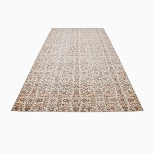 Alfombra vintage de lana beige descolorida