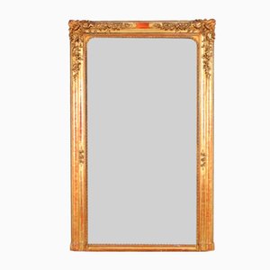 Specchio in legno dorato e intagliato