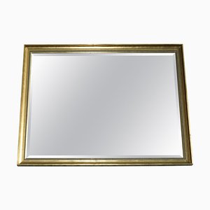 Espejo de pared con marco de pino de madera dorada y placa de vidrio con borde biselado