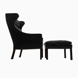 Sillón de orejas de cuero negro y reposapiés de Borge Mogensen para Fredericia, años 60. Juego de 2