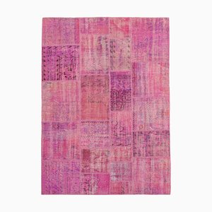 Alfombra rosa de patchwork