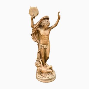 Estatua de bronce del querubín de Baco