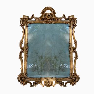 19th Century European Romantic Mirror. Carved and Gilded Wood Frame
