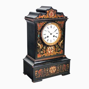 Reloj de péndulo de madera con incrustaciones, década de 1800