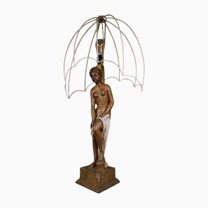 Figural Lamp with a Shaped Hood