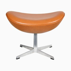 Reposapiés en forma de huevo coñac de cuero de Arne Jacobsen, años 90