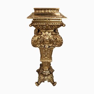 Columna de bronce grabada en oro, siglo XX