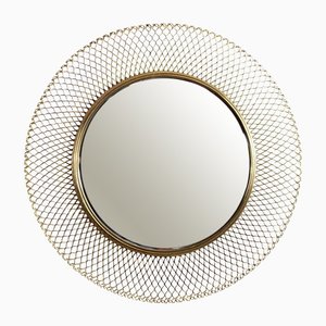 Espejo redondo de metal dorado de Mathieu Matégot, años 50