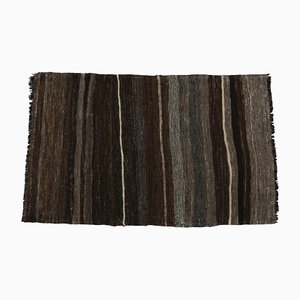Alfombra Kilim turca vintage de lana marrón oscuro a rayas