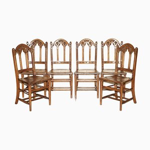 Antike Esszimmerstühle aus geschnitztem Nussholz im Neugotischen Stil von Charles & Ray Eames, 6 . Set