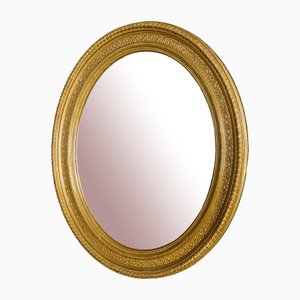 Specchio ovale antico con cornice dorata