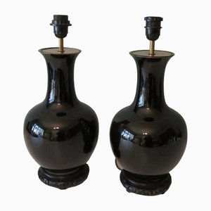 Schwarze verspiegelte Keramiklampen auf geschnitzten Holzfüßen, 1950, 2er Set