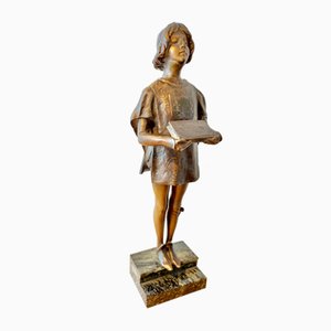 Figura de página en la base de Léon Noel Delagrange, 1900, Bronce