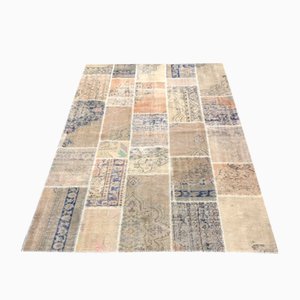 Alfombra de patchwork tejida a mano