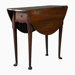Mesa abatible antigua de madera con patas