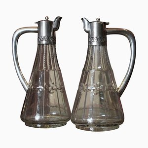 Juego de aceitera y vinagrera inglesa de vidrio tallado y plata esterlina, siglo XIX. Juego de 2