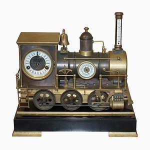 Locomotora industrial francesa con reloj de bronce dorado en movimiento, 1895