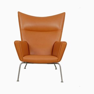 Sillón de orejas Anilin coñac de Hans J. Wegner para Carl Hansen & Søn, años 90