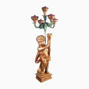 Candelabro Putto de madera dorada del siglo XVIII