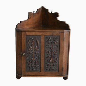 Corner Wall Cabinet in Carved Walnut