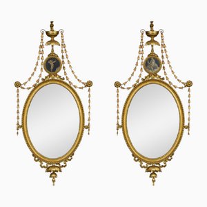 Espejos Adam Revival ovalados con marco dorado, década de 1890. Juego de 2