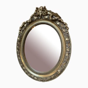 Espejo ovalado tallado con cinta