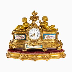 Uhr aus vergoldeter Bronze und Porzellan, 19. Jh