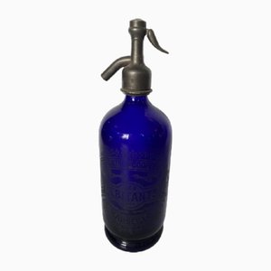 Botella de refresco vintage de vidrio azul, años 20
