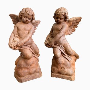 Figuras de Putti vintage de hierro fundido, 1920. Juego de 2