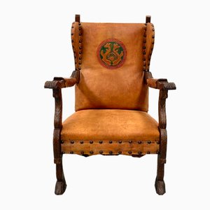 French Wing Chair in Cognac Leather with Carvings, 1920s