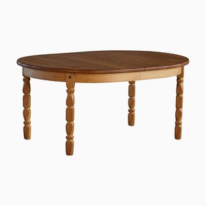 Mesa de comedor danesa ovalada de roble con dos extensiones de Henning Kjærnulf, años 60