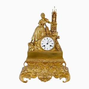 Reloj de péndulo decorativo Napoleón III de bronce dorado, siglo XIX