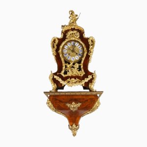 Reloj de pared estilo rococó con consola, década de 1800