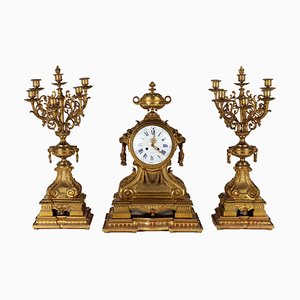Reloj tríptico y candelabros de bronce, Francia, siglo XIX. Juego de 3