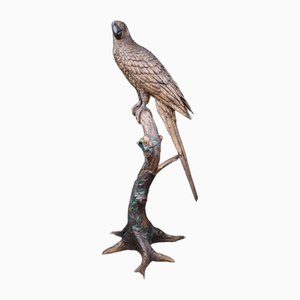 Estatua de loro grande de bronce con rama de pájaro