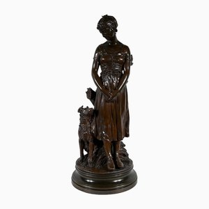 Truffot, giovane donna con cane, fine XIX secolo, bronzo