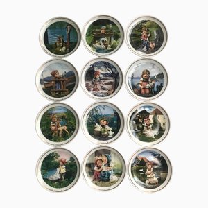 Collectible Porcelain Goebel Plates in the style of Maria Hummel, 2000s, Set of 12