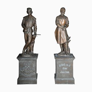 Estatuas de trabajadores del metal del gremio de artesanos grandes de bronce. Juego de 2