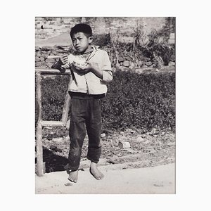Hanna Seidel, Hong Kong Boy with Food, Black and White Photograph, 1960s