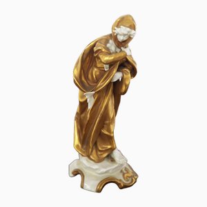 Statuetta Capricorno in ceramica dorata di Capodimonte, inizio XX secolo