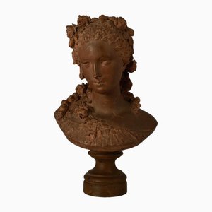 Albert-Ernest Carrier-Belleuse, Busto de mujer con corona floral, década de 1800, terracota