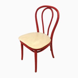 Silla de comedor vintage de madera roja con asiento de cuero blanco, años 70